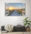 Naklejka do salonu WIDOK PRZEZ OKNO BIAŁE zachód słońca nad morzem pomost
